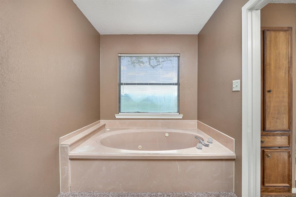 24264 State Highway Canton, TX 75103 - Photo 24 of 38 a bathroom with a bathtub