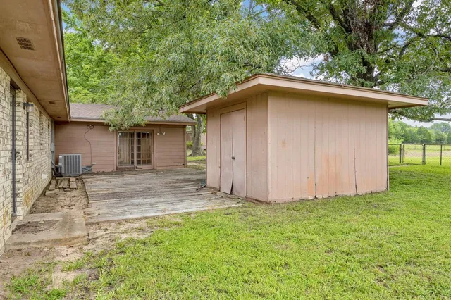 a backyard of a house with lots of green space