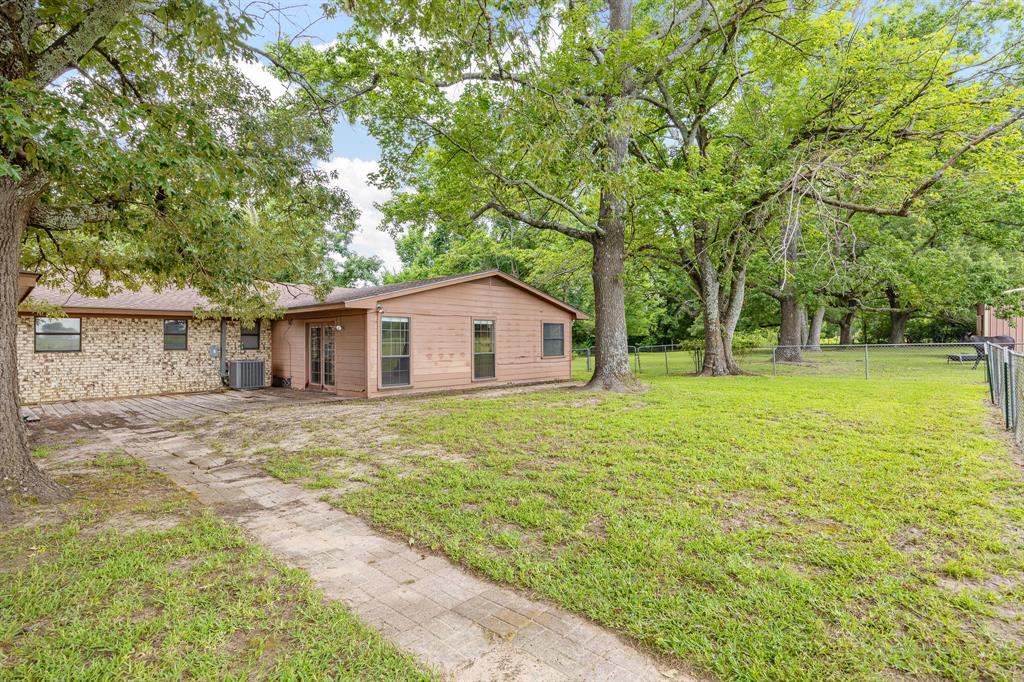 24264 State Highway Canton, TX 75103 - Photo 26 of 38 a front view of house with yard and trees