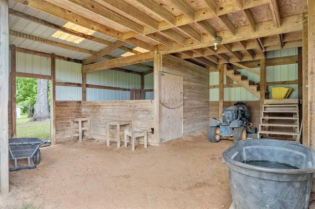 a view of a room with chairs and a table