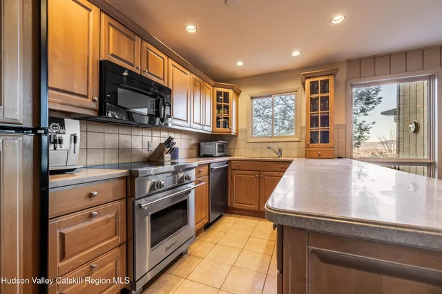 a living room with furniture and stairs
