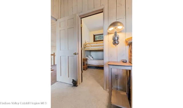 a bathroom with a sink a toilet a mirror and bathtub