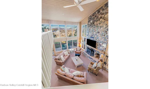 a bathroom with a glass shower door and mirror