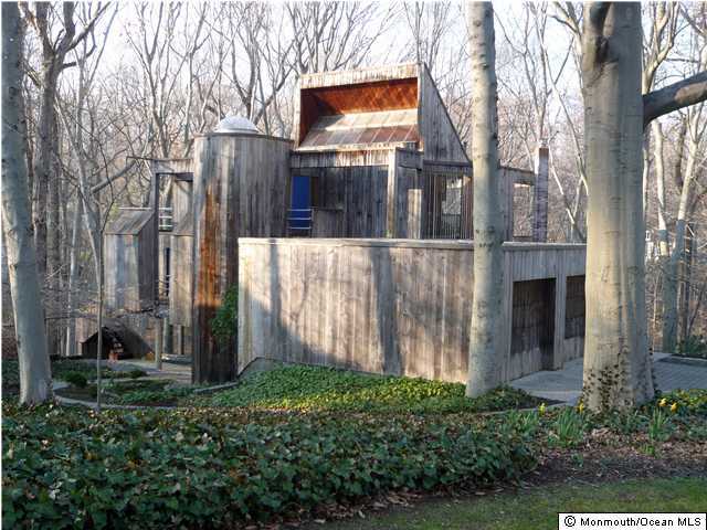177 Pelican Road Middletown, NJ 07748 - Photo 2 of 3 a view of a house with a small yard and large tree