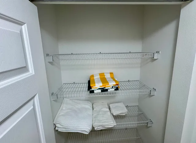 a bedroom with a bed and furniture