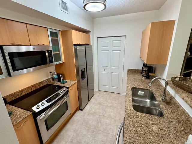 a view of a glass door with a balcony