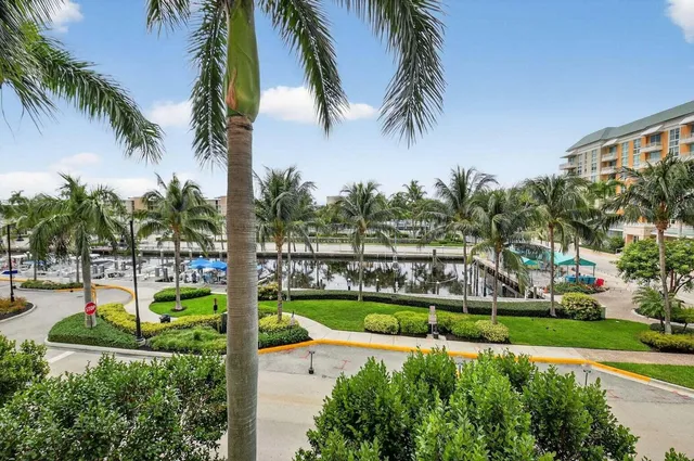 a bathroom with a sink a toilet a mirror and shower