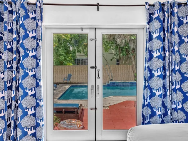 a view of a porch with a floor to ceiling window