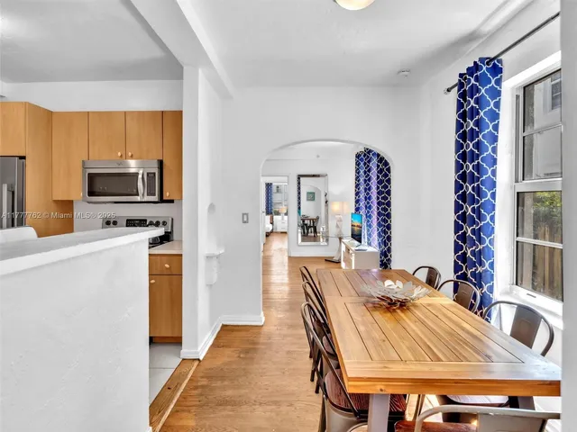 a very nice looking dining room with a large window