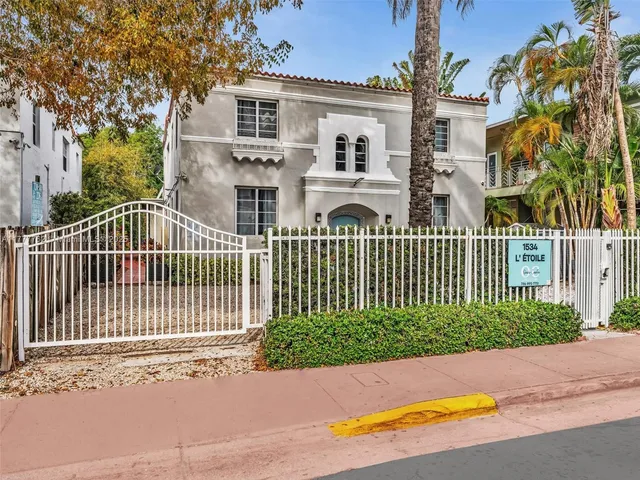 front view of a house with a garden
