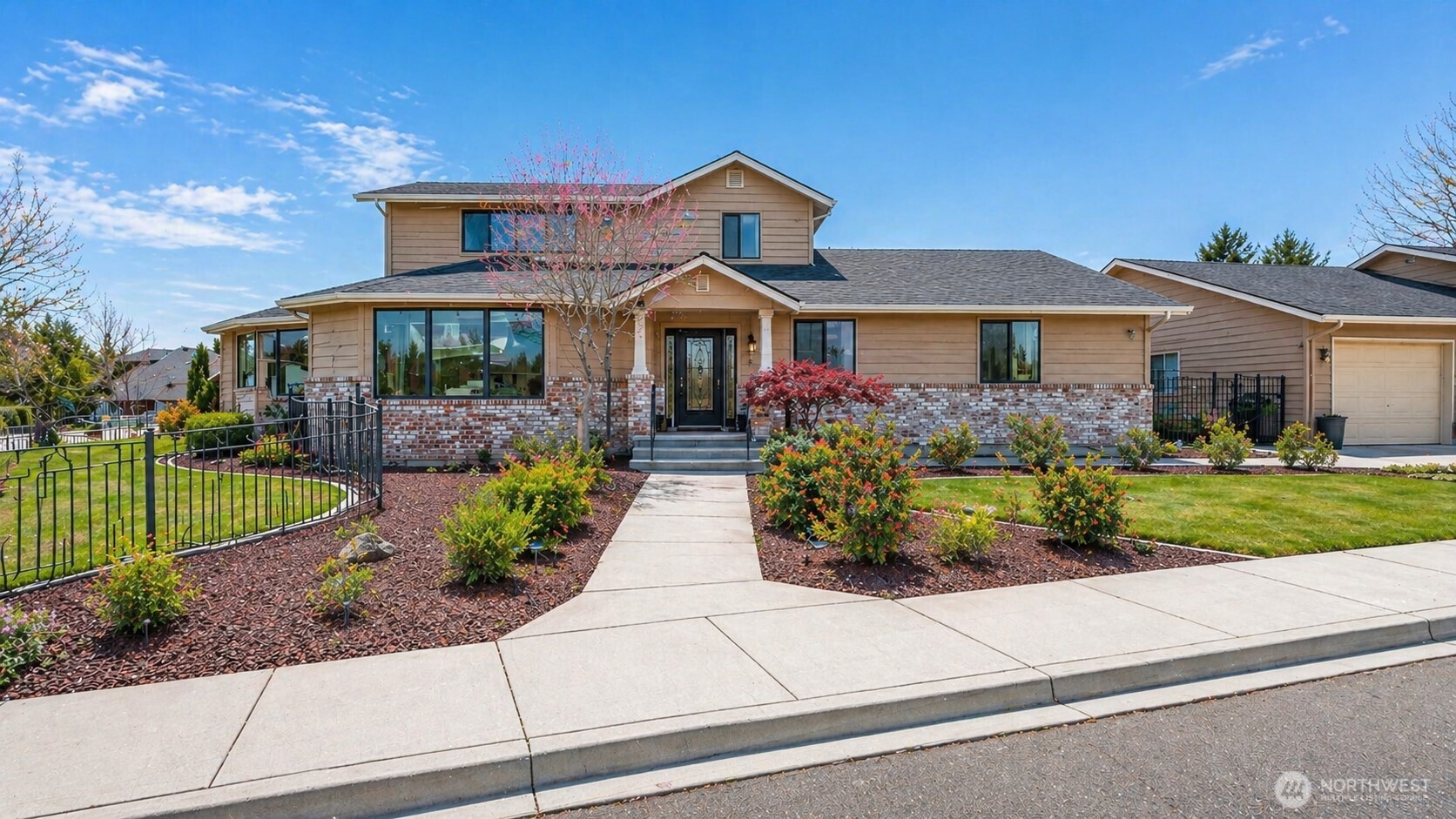 1343 Highland Road Walla Walla, WA 99362 - Photo 2 of 40 a front view of a house with a yard and potted plants