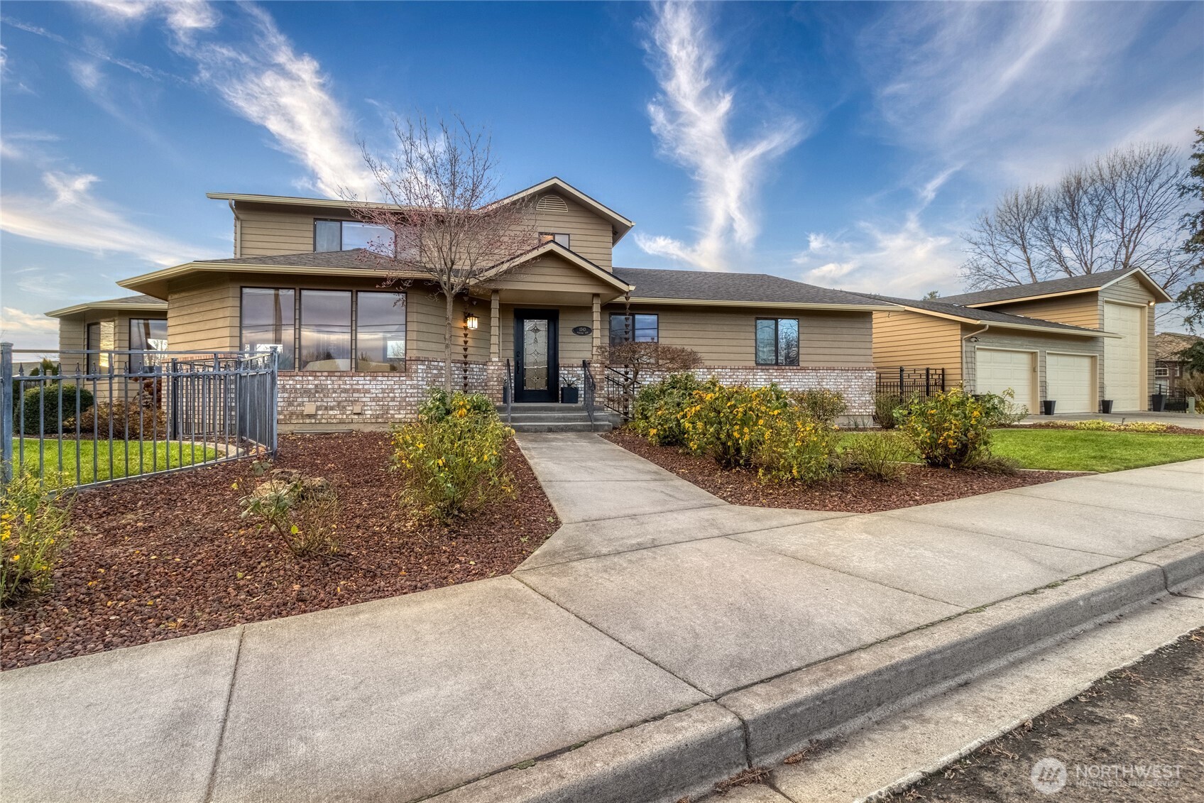 1343 Highland Road Walla Walla, WA 99362 - Photo 40 of 40 a front view of a house with a yard and potted plants