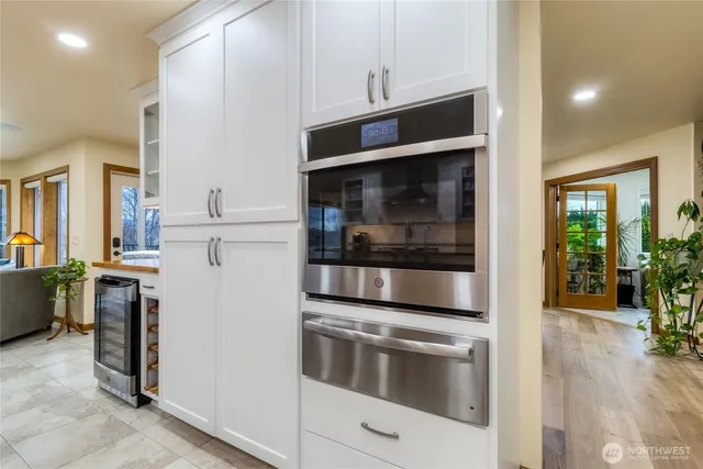a kitchen with stainless steel appliances and cabinets