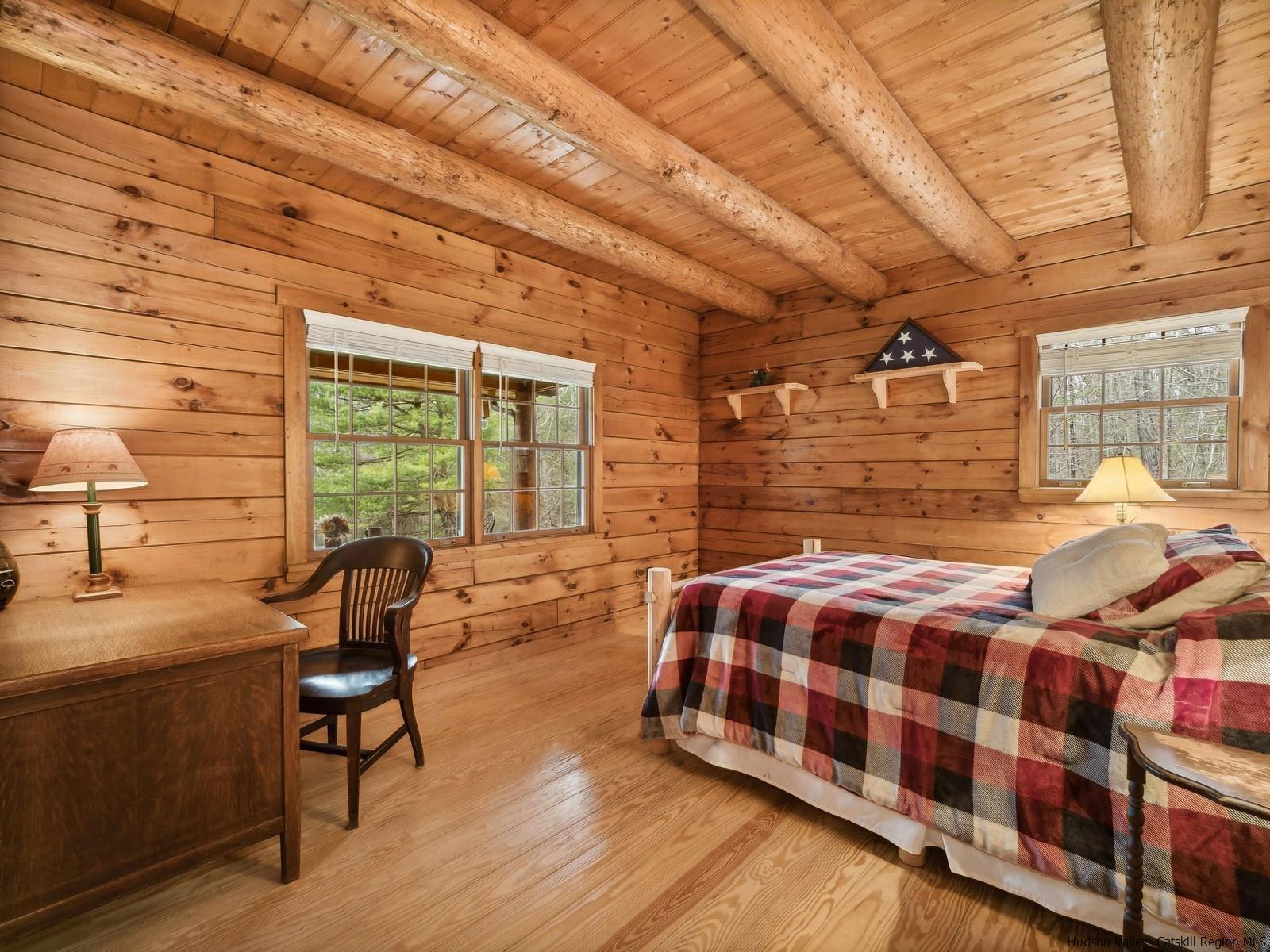 815 Peak Road Stone Ridge, NY 12484 - Photo 17 of 35 a bedroom with furniture and a large window