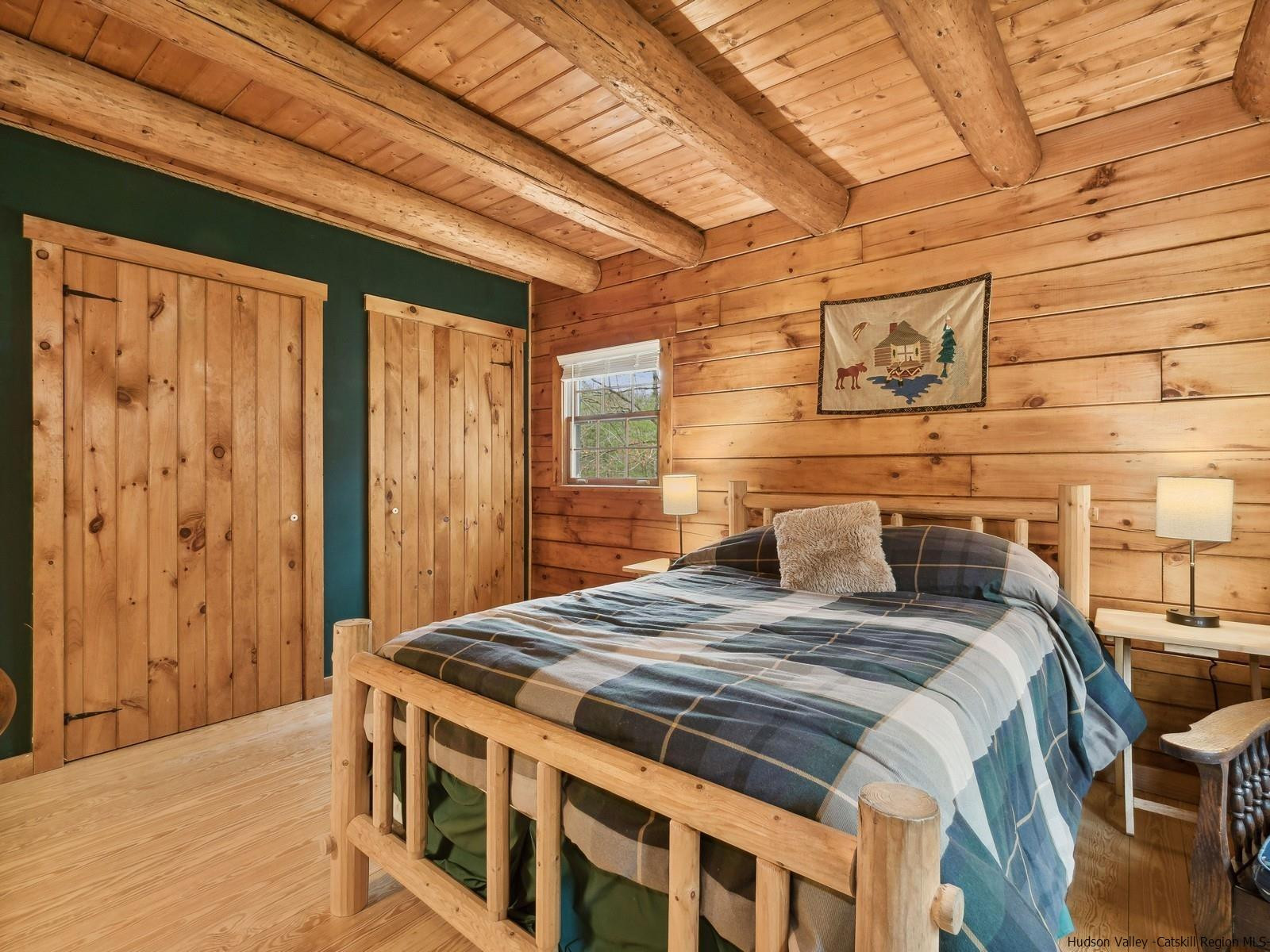 815 Peak Road Stone Ridge, NY 12484 - Photo 20 of 35 a bed sitting in a bedroom next to a window