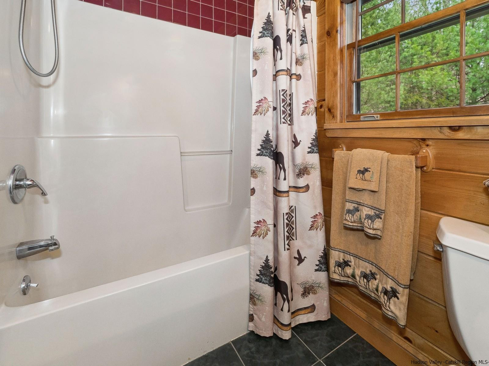 815 Peak Road Stone Ridge, NY 12484 - Photo 22 of 35 a bathroom with a bathtub and shower