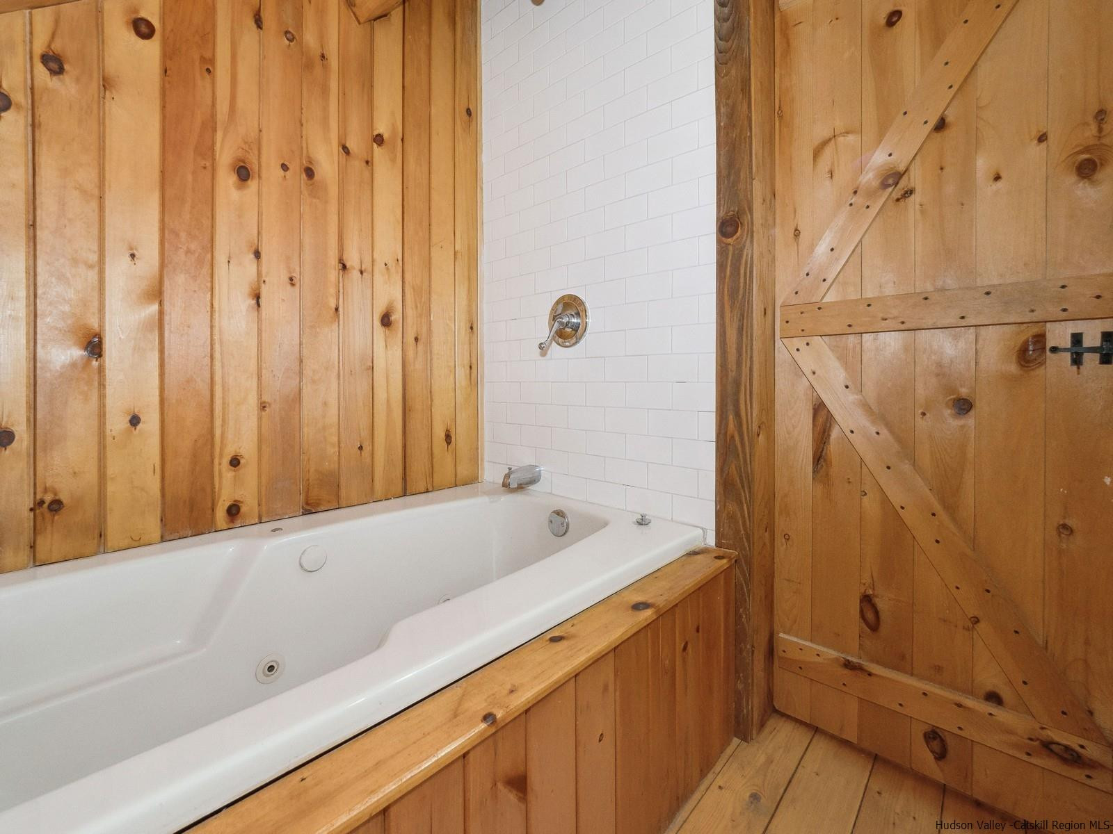815 Peak Road Stone Ridge, NY 12484 - Photo 26 of 35 a bathroom with a bathtub and a sink