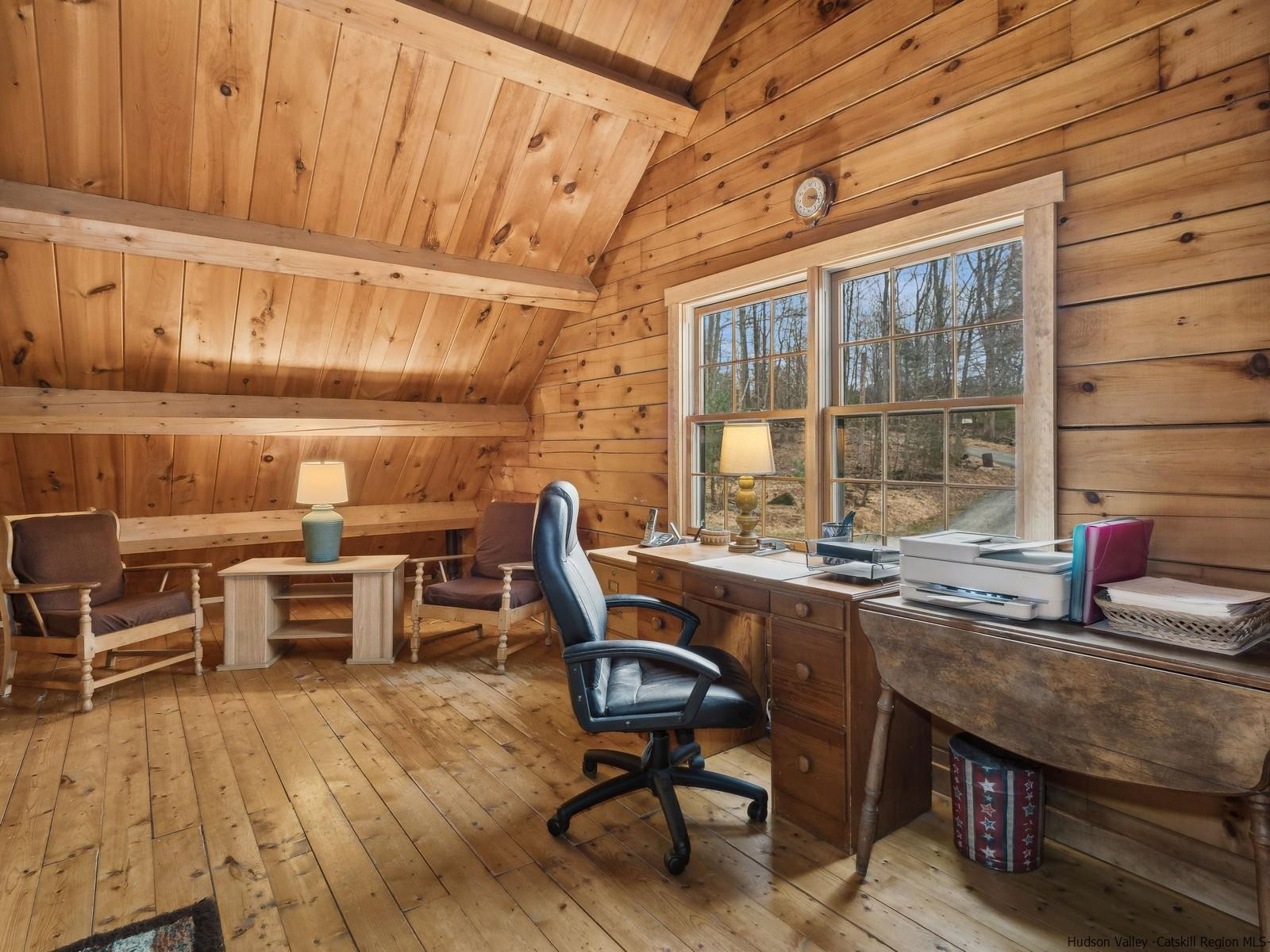 815 Peak Road Stone Ridge, NY 12484 - Photo 30 of 35 a dining room with a wooden table and chairs