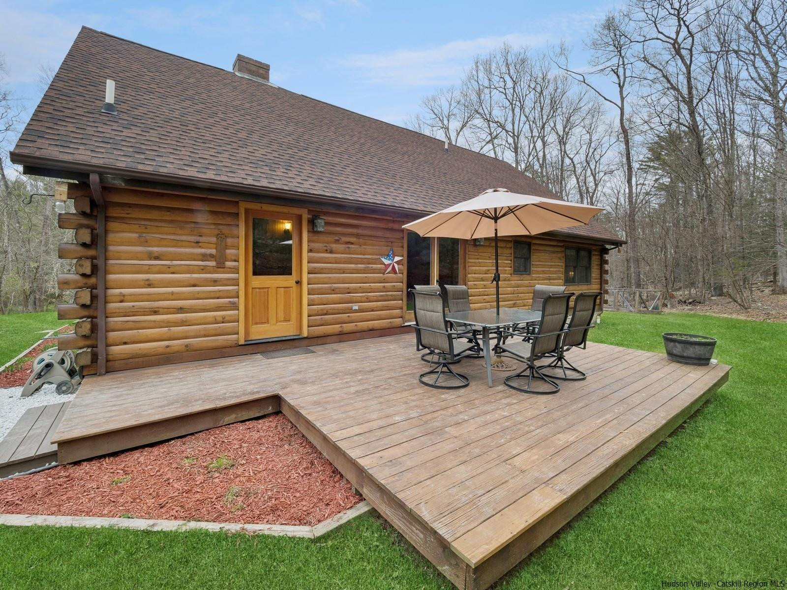 815 Peak Road Stone Ridge, NY 12484 - Photo 32 of 35 a view of a wooden chairs and table in backyard