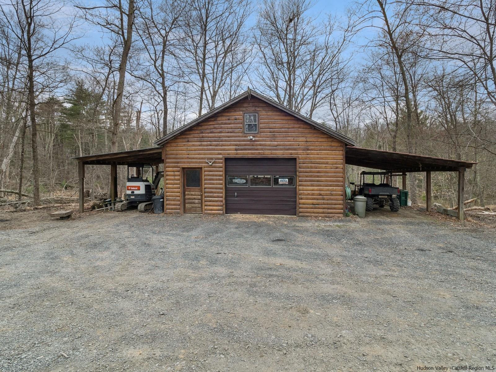 815 Peak Road Stone Ridge, NY 12484 - Photo 35 of 35 a view of a house with a yard and garage