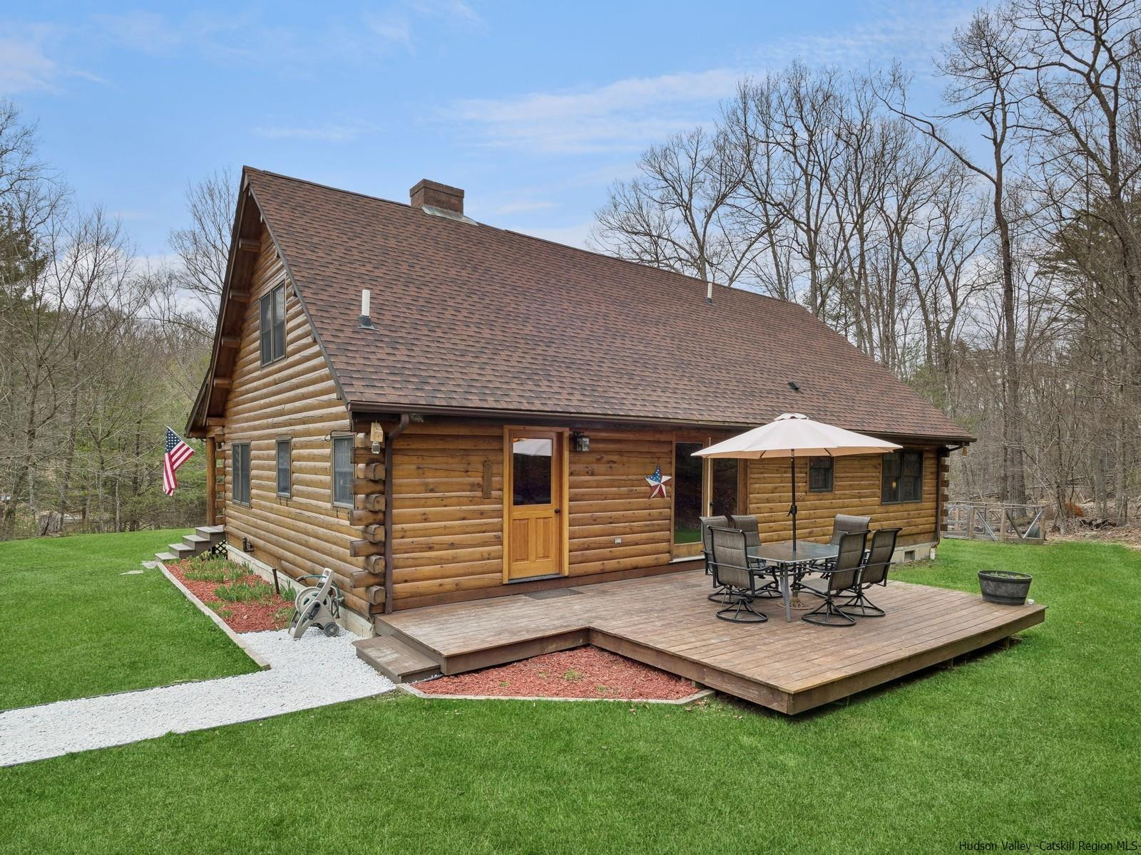 815 Peak Road Stone Ridge, NY 12484 - Photo 4 of 35 a backyard of a house with table and chairs