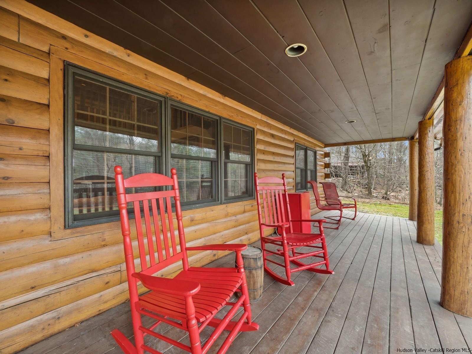 815 Peak Road Stone Ridge, NY 12484 - Photo 5 of 35 a sitting area with furniture and wooden deck