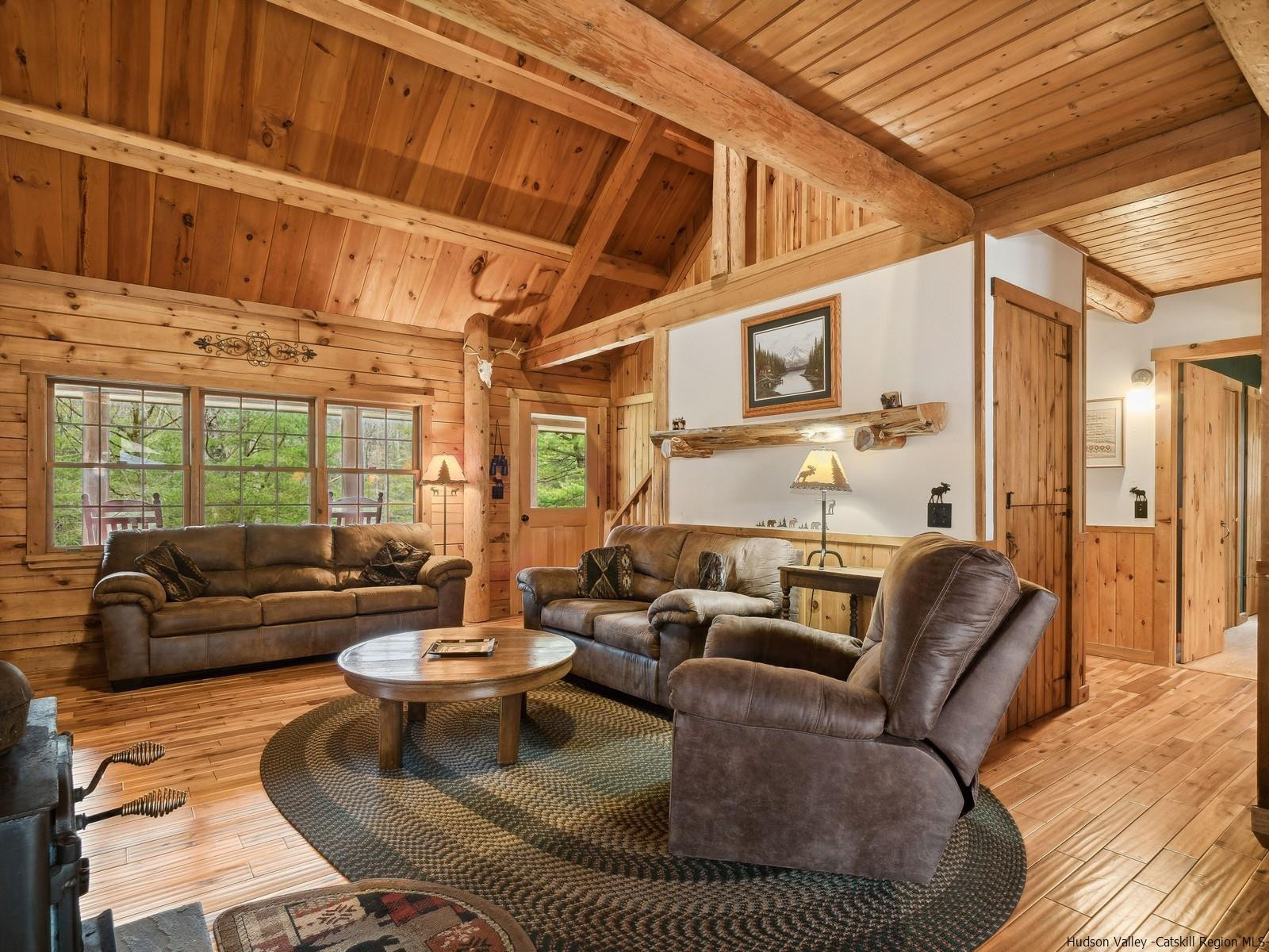 815 Peak Road Stone Ridge, NY 12484 - Photo 9 of 35 a living room with furniture and a large window