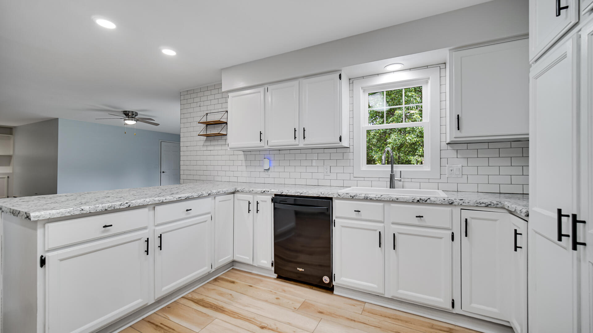 6717 State Rte 49 Rensselaer, IN 47978 - Photo 10 of 31 a kitchen with granite countertop white cabinets and white appliances