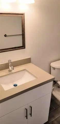a bathroom with a sink and a toilet