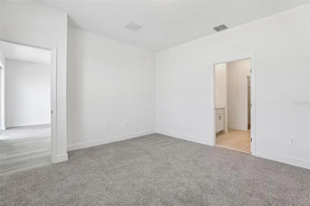 a bathroom with a double vanity sink toilet mirror and shower