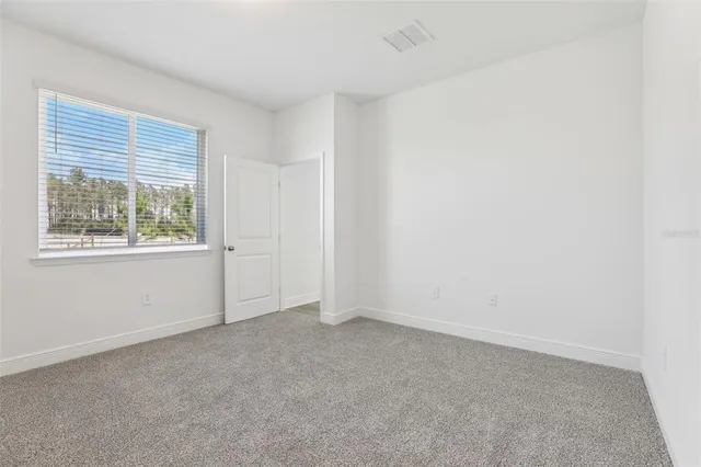 a bathroom with a double vanity sink toilet and a mirror
