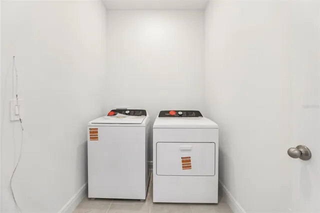 a bathroom with 2 sink tub and a mirror