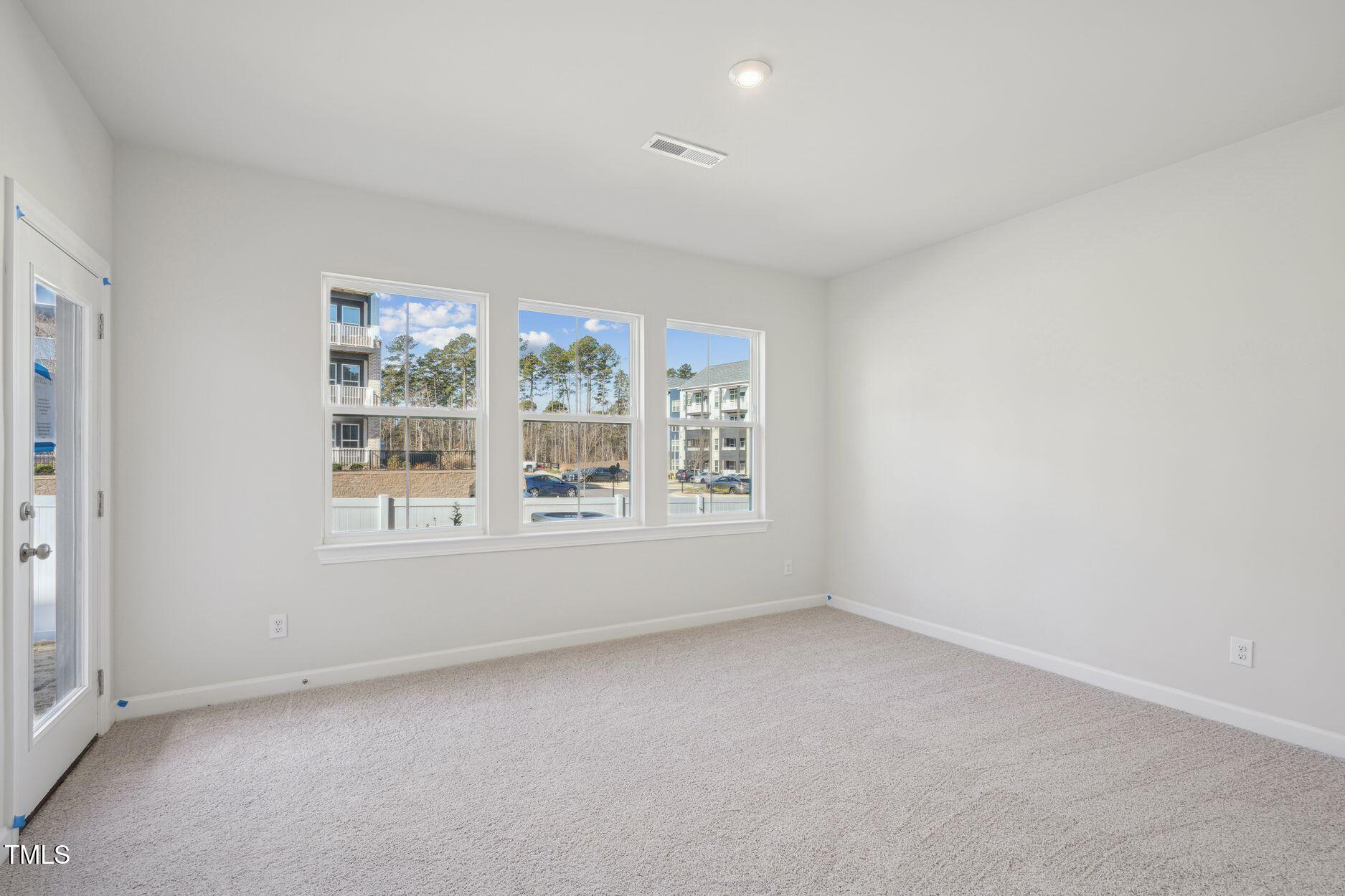 4717 Cypress Tree Lane Raleigh, NC 27612 - Photo 5 of 11 Elm Park 59_Den_2.3.25_webready