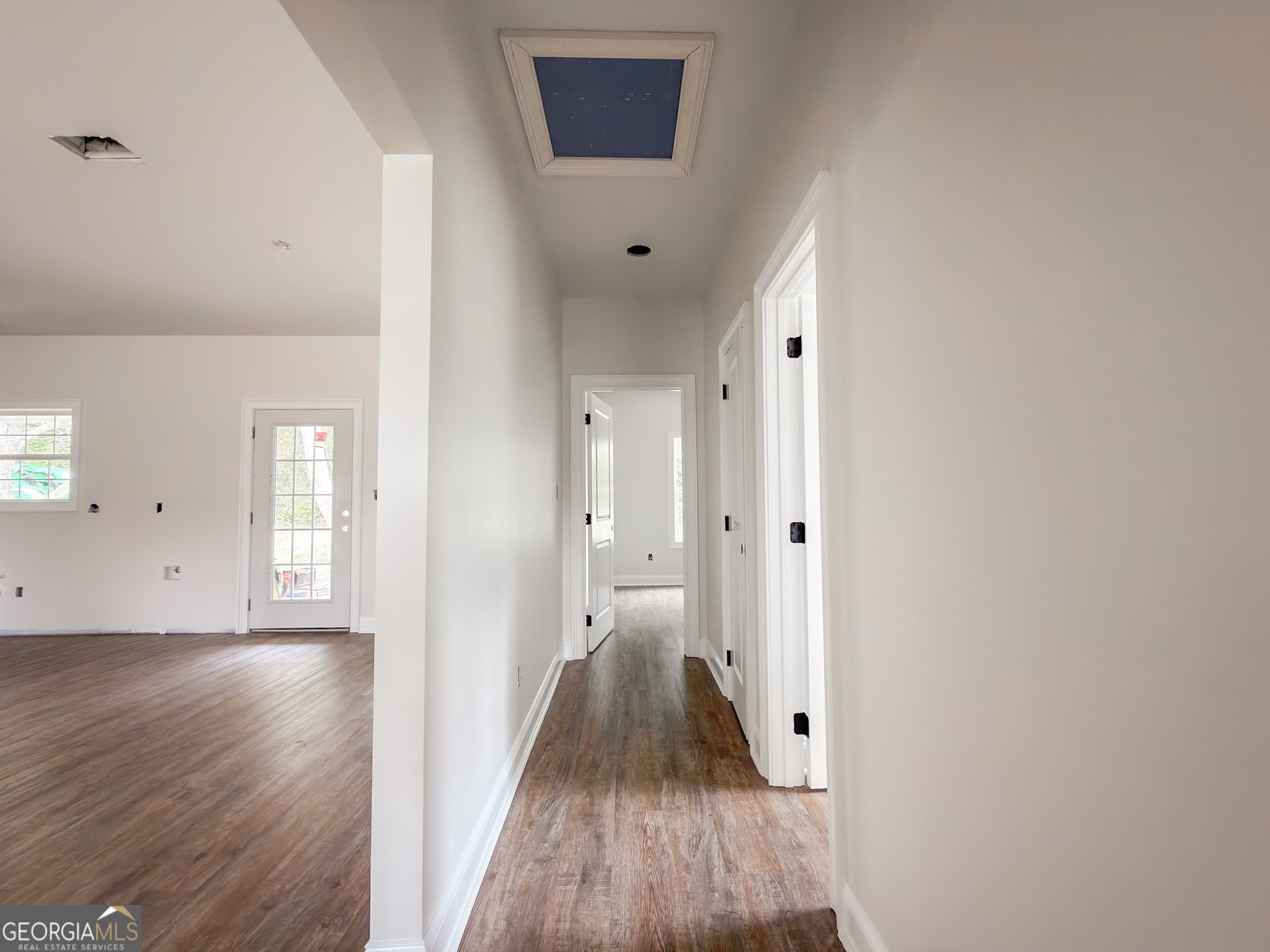352 College Street Southwest Pelham, GA 31779 - Photo 8 of 9 wooden floor in an empty room with a window