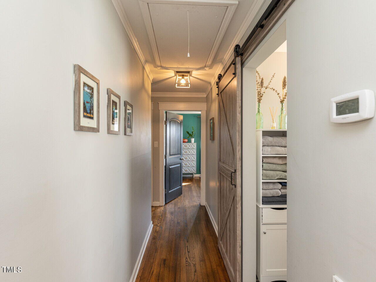 125 Crestview Drive Durham, NC 27712 - Photo 15 of 30 a view of hallway with stairs and wooden floor