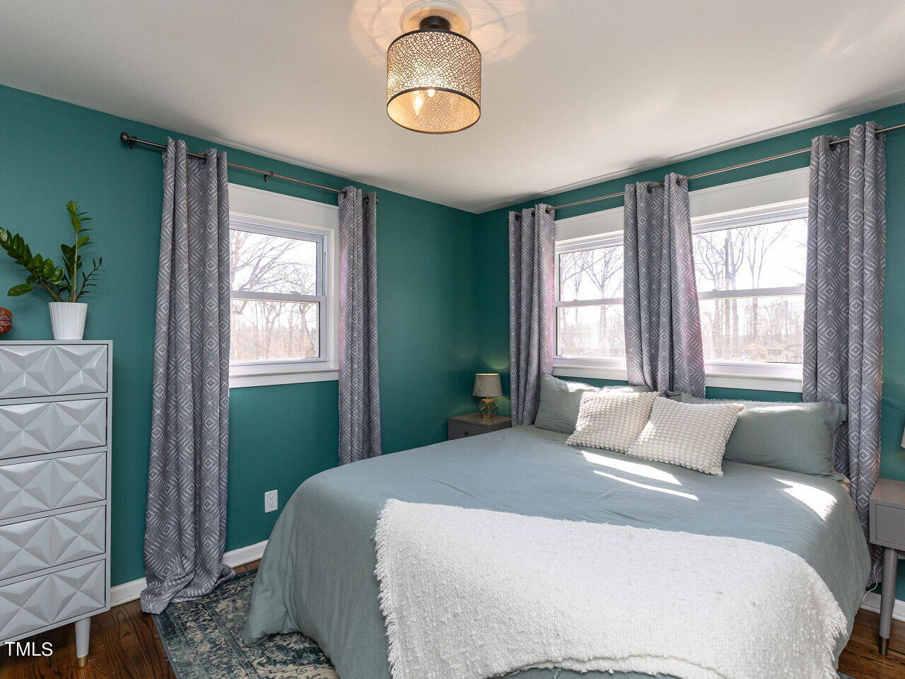 125 Crestview Drive Durham, NC 27712 - Photo 17 of 30 a bedroom with a bed and window