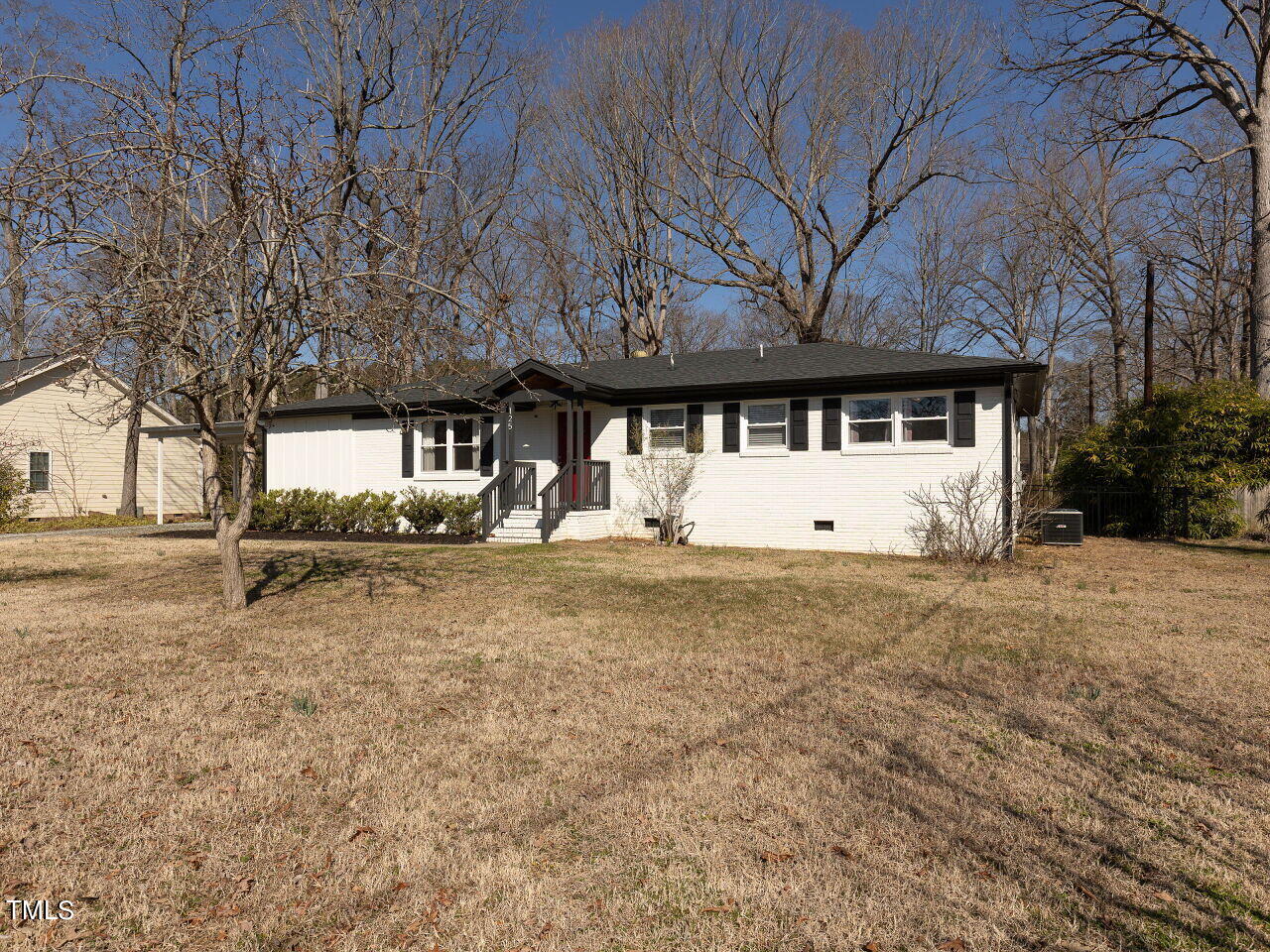 125 Crestview Drive Durham, NC 27712 - Photo 2 of 30 a view of a house with a yard and garage