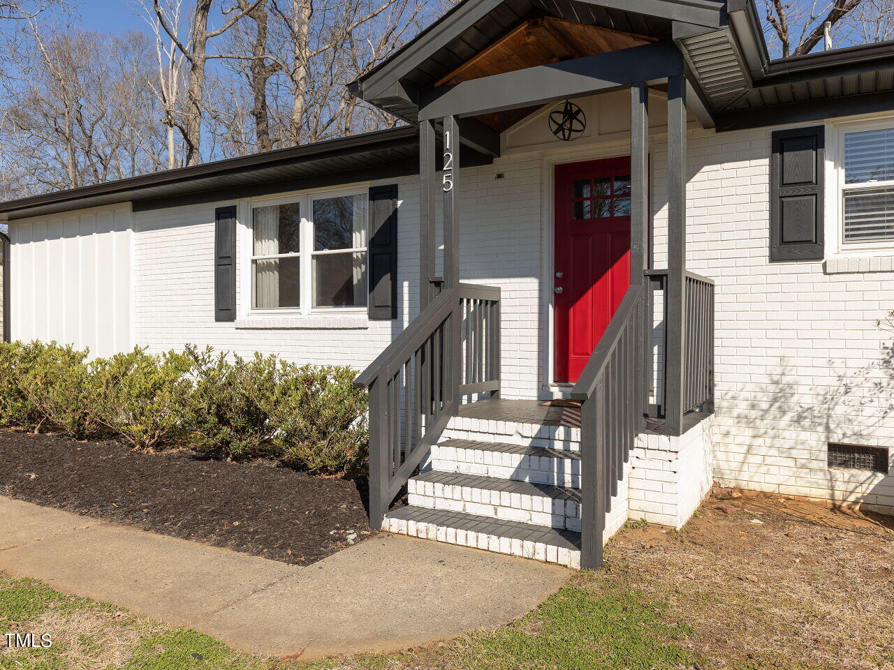 125 Crestview Drive Durham, NC 27712 - Photo 5 of 30 a front view of a house with a yard