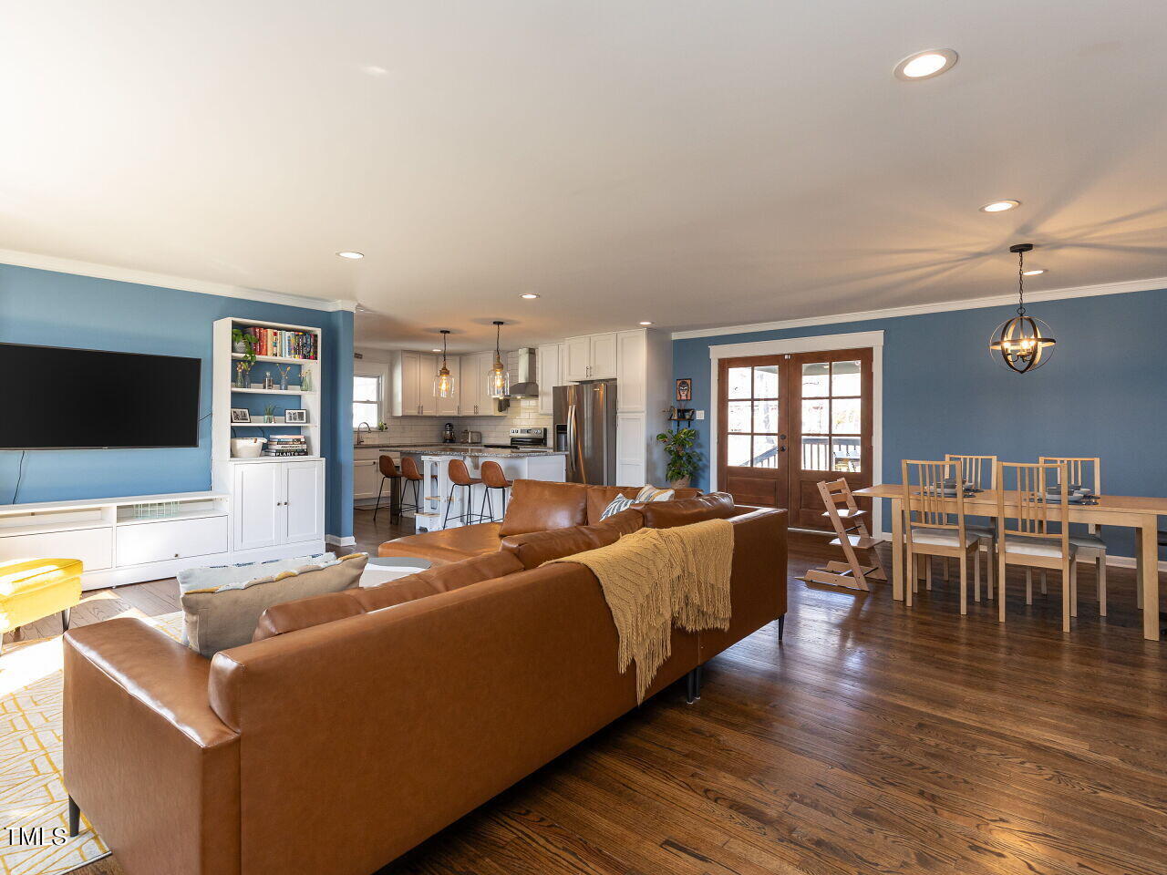 125 Crestview Drive Durham, NC 27712 - Photo 6 of 30 a living room with furniture wooden floor and a flat screen tv