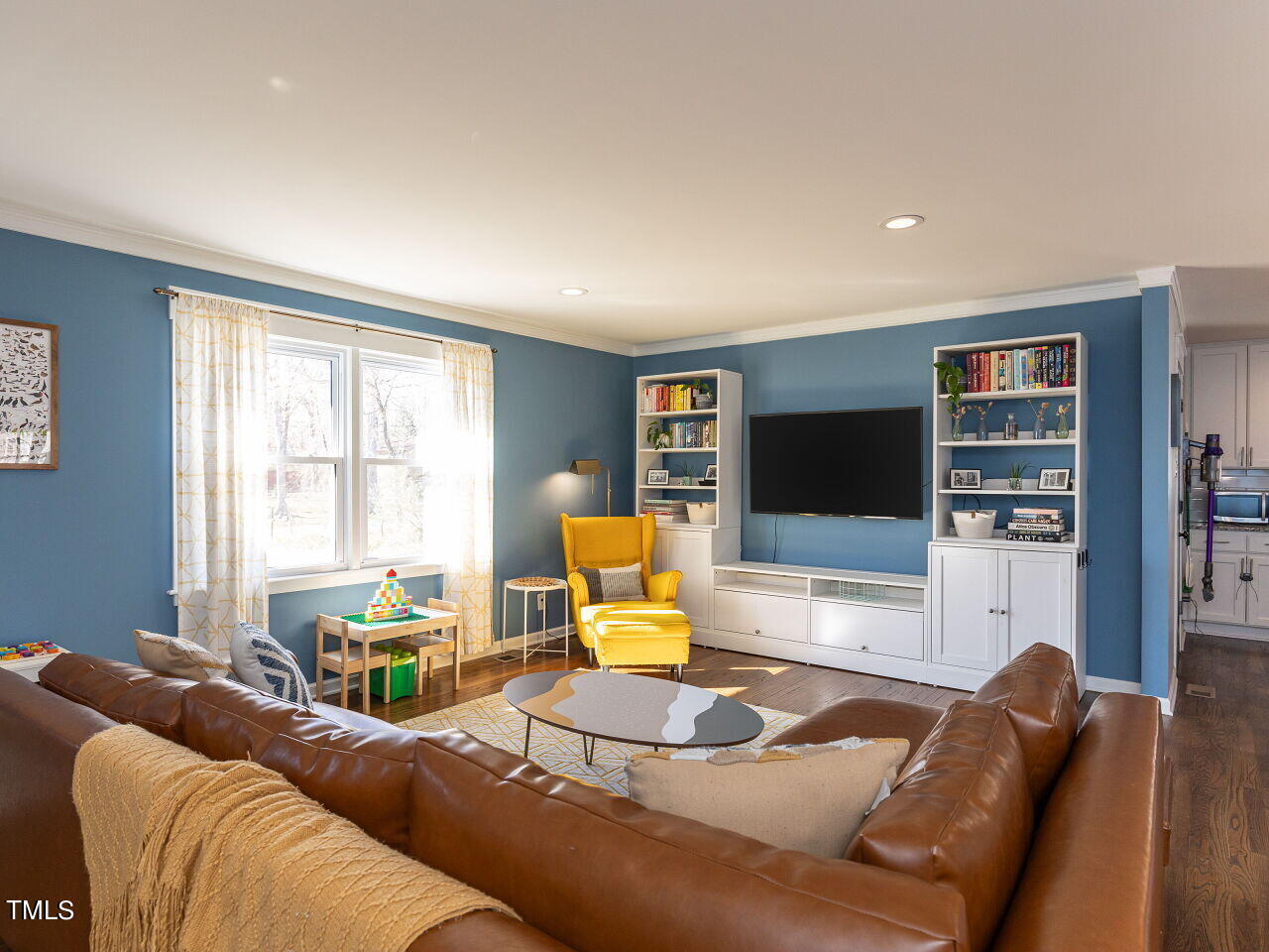 125 Crestview Drive Durham, NC 27712 - Photo 7 of 30 a living room with furniture and a flat screen tv