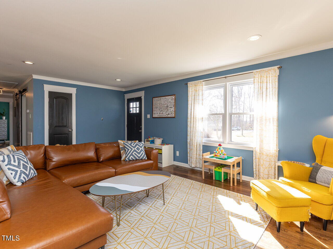125 Crestview Drive Durham, NC 27712 - Photo 8 of 30 a living room with furniture and a large window