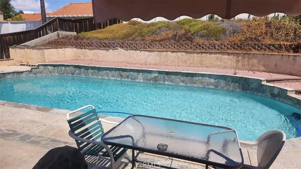 a view of a backyard of the house