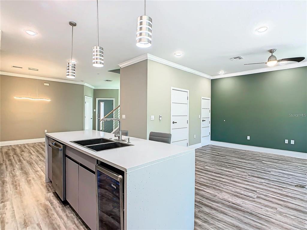 2000 Greenbriar Terrace Davenport, FL 33837 - Photo 13 of 50 a kitchen that has a sink a stove and a table