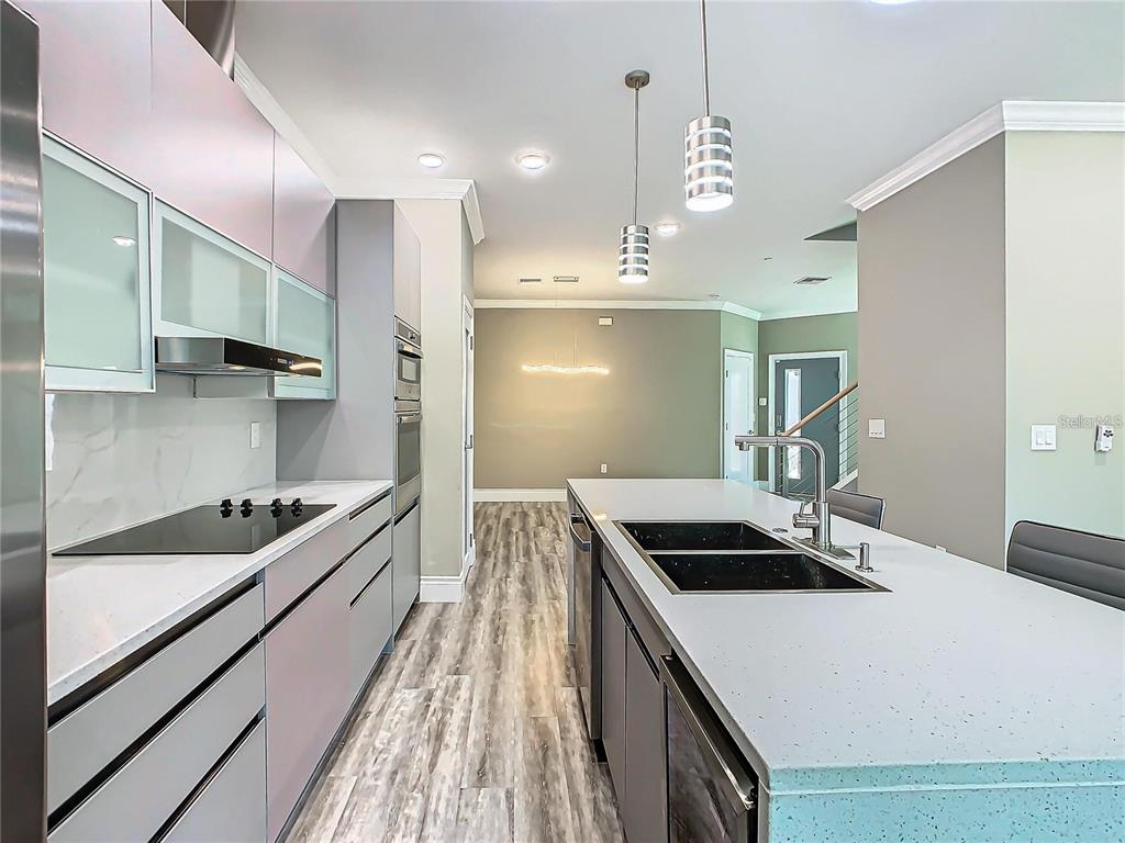 2000 Greenbriar Terrace Davenport, FL 33837 - Photo 14 of 50 a kitchen with kitchen island a sink and stove
