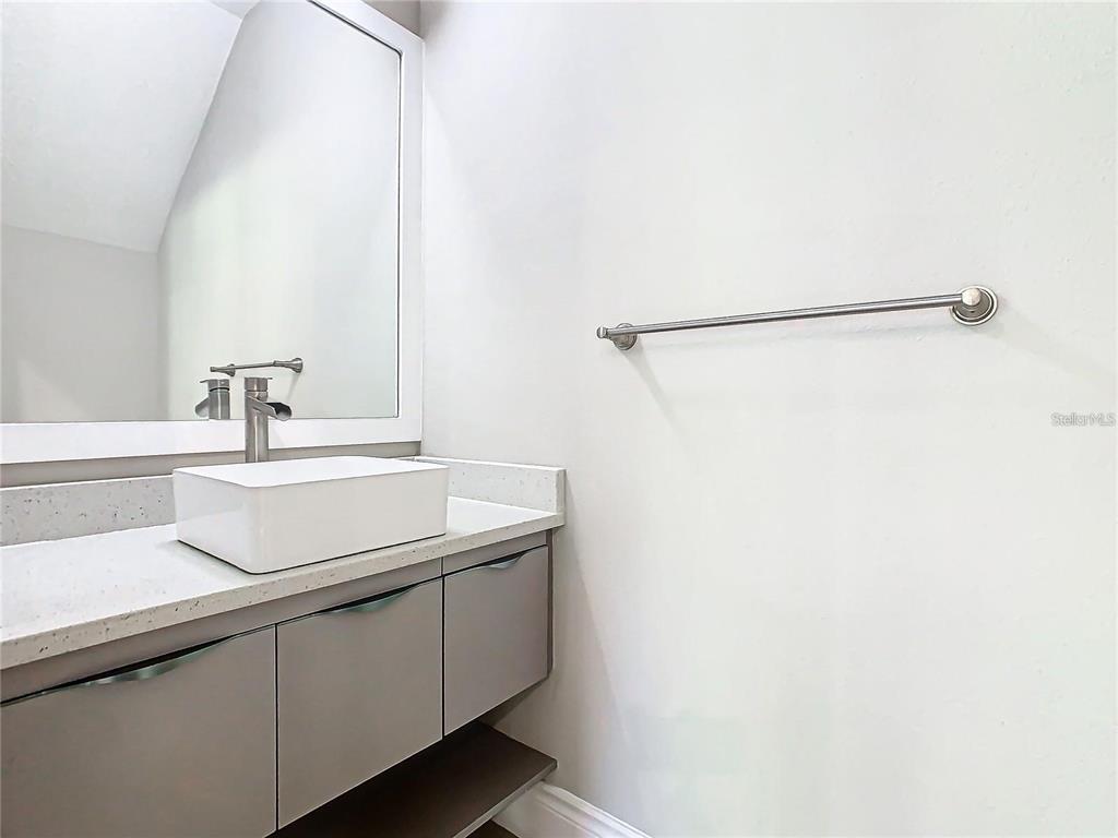 2000 Greenbriar Terrace Davenport, FL 33837 - Photo 35 of 50 a bathroom with a sink and a mirror