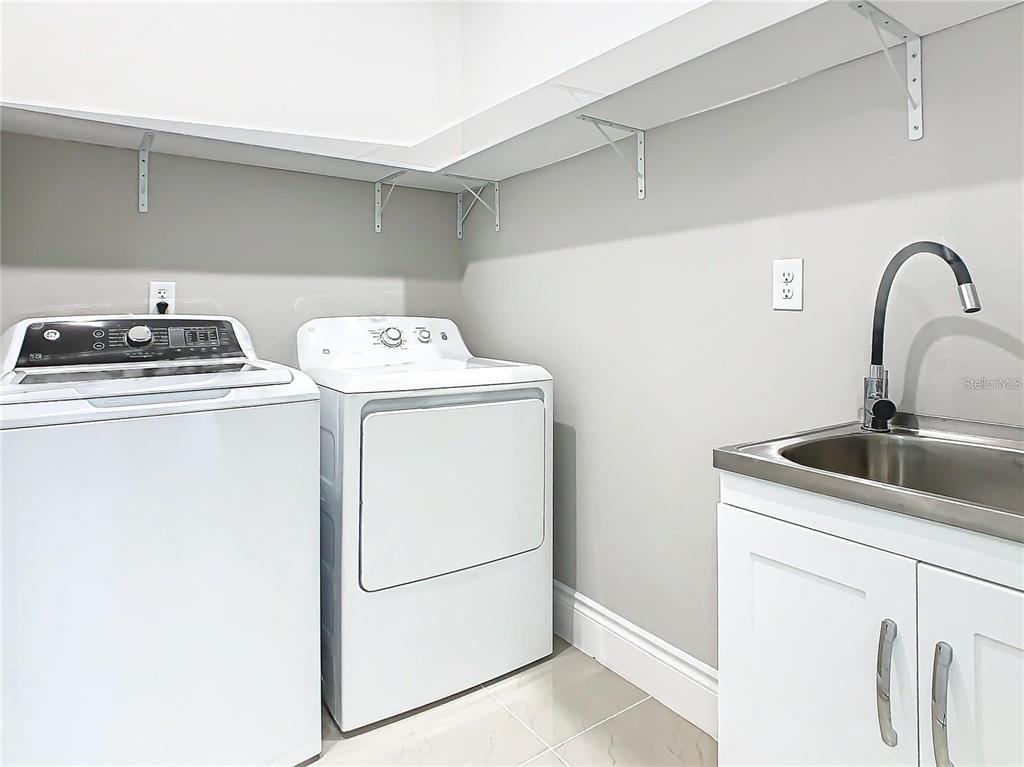 2000 Greenbriar Terrace Davenport, FL 33837 - Photo 36 of 50 a utility room with dryer and washer