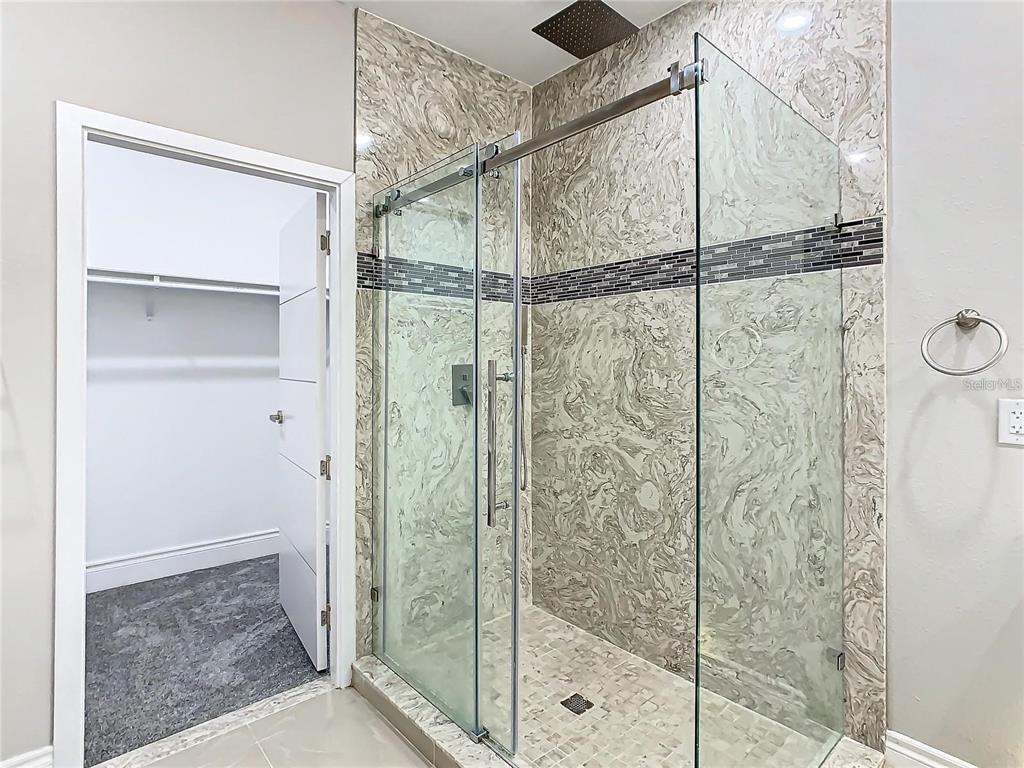 2000 Greenbriar Terrace Davenport, FL 33837 - Photo 40 of 50 a bathroom with a shower and a glass door