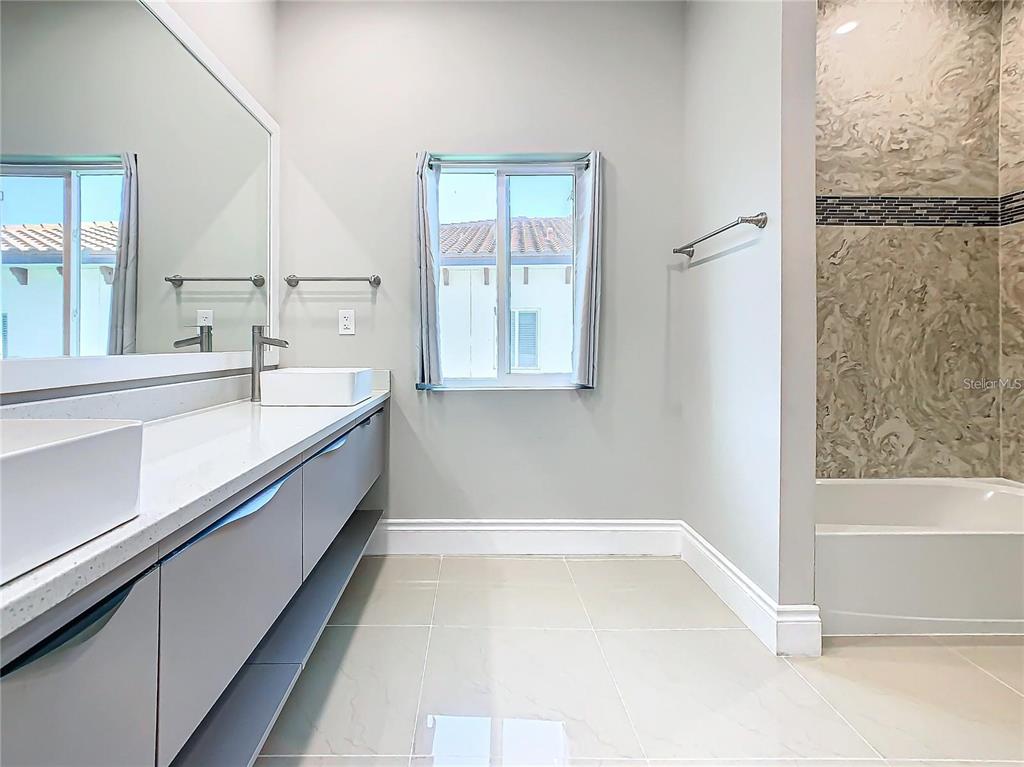 2000 Greenbriar Terrace Davenport, FL 33837 - Photo 4 of 50 a bathroom with a bathtub and a shower