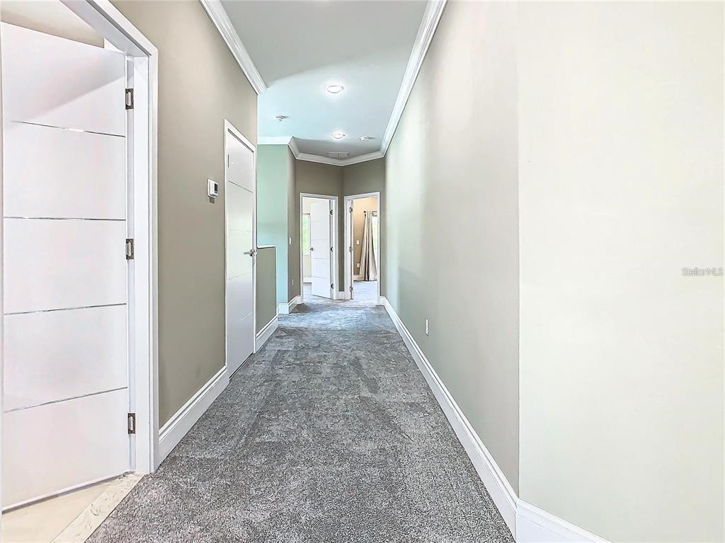 2000 Greenbriar Terrace Davenport, FL 33837 - Photo 43 of 50 a view of a hallway with a white walls