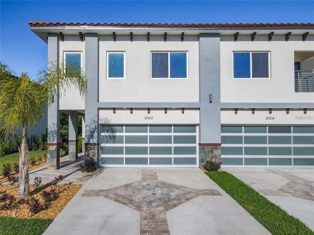 2000 Greenbriar Terrace Davenport, FL 33837 - Photo 50 of 50 a front view of a house with a yard and garage